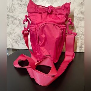 Calpak water bottle holder in dragonfruit pink